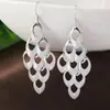 Dz Pendientes de gancho con borla estilo europeo y americano, cola de pavo real, para mujer, aretes exagerados de personalidad de nicho calados, aretes de lujo ligero de alta gama de moda
