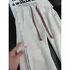 Pantalones de chándal rectos de retazos a cuadros blancos y grises para hombre, diseño de otoño de peso pesado, pantalones ligeramente acampanados, pantalones deportivos casuales americanos