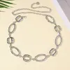 Cadena de cintura de metal hueca ovalada de verano transfronteriza, cadena corporal europea y americana creativa, cinturón de mujer versátil y moderno personalizado