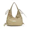 Bolsos de nicho coreanos, bolso tote grande para mujer, bolso de hombro informal de moda para el trabajo, bolso tipo cubo simple y versátil