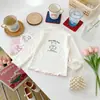 Camiseta de manga larga con bloques de color, volantes y cuello semi-alto, estampado de dibujos animados, para niñas de otoño, ropa para niños, fuente de capa interior