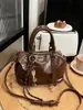 Bolso de mano tipo almohada de alta moda retro para mujer, nuevo estilo otoño e invierno 2026, bolso de hombro elegante, bolso cruzado versátil para el día a día