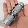 Venta al por mayor de fábrica Zoom mini sk68 linterna de luz fuerte linterna portátil lámpara de camping lámpara con clip para bolígrafo