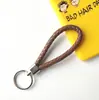 Llavero creativo llavero de cuerda de cuero cordón para llaves colgante de joyería cordón tejido fábrica de cuerda de cuero venta al por mayor