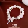 Pulsera con colgante de lazo de circonita con perlas de doble capa, sensación de lujo ligero y alta gama, accesorio de mano elegante y versátil