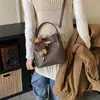 Elegante bolso pequeño retro para mujer, nuevo bolso cruzado versátil de moda 2026, bolso de cubo de mano popular y moderno