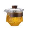 Tetera de vidrio de borosilicato de alta calidad con tapa de madera, resistente a la lluvia y con aislamiento térmico, con textura martillada y filtro incorporado para separar el té del agua.
