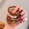 Cuerda para el pelo de nuevo estilo 2024 para niñas, Cuerda de goma para el pelo elegante, Goma para el pelo elegante y con clase, Accesorio para el pelo con funda de cuero simple