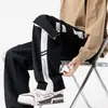 Pantalones rectos de moda con múltiples bolsillos para hombre, corte casual holgado, talla grande, estilo americano, versátiles pantalones cargo deportivos para primavera y otoño