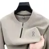 Nueva colección Primavera/Otoño 2026: sudadera con medio cierre y estampado de letras para hombre, prenda base de cuello redondo, camiseta de manga larga cómoda y de corte holgado