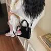 Bolso bandolera cruzado de hombro de moda de color liso popular para mujer 2026, nuevo bolso cuadrado pequeño casual para ir al trabajo, versátil