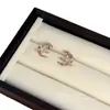 Pendientes de botón de lujo ligero estilo francés de estrella y luna para mujer, diseño de nicho con exquisita circonita microincrustada, pendientes de temperamento versátiles