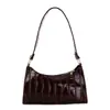El popular bolso texturizado de este año para mujer, nuevo modelo de otoño 2026, bolso de hombro de color liso con patrón de cocodrilo, bolso de moda para llevar debajo del brazo