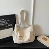 Mochila de viagem feminina cor sólida estilo coreano, nova bolsa transversal de ombro casual primavera 2026, bolsa de tecido de grande capacidade