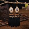 Pendientes largos con forma de pluma de estilo étnico, venta al por mayor, con diseño bohemio vintage para mujer, con borlas y cuentas, con temperamento
