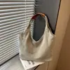 Bolso de mezclilla artístico de nicho estilo coreano 2026 para mujer, gran capacidad, sensación de alta gama, bandolera versátil para mujer, adecuado para ir al trabajo
