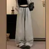 Pantalones de pierna ancha a rayas de cintura alta con diseño de otoño para mujer 2026 Nuevo estilo perezoso con cordón Pantalones casuales de pierna ancha y recta
