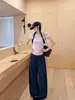 Moda de otoño, pantalones casuales suaves de color blanco roto de pierna ancha con bolsillos delanteros, pantalones fluidos hasta el suelo, pantalones de chándal rectos holgados y estilizados