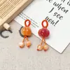 Accesorio popular de TikTok con colgante de flor de ciruelo pequeña que cambia de color, llavero hecho a mano con tallado fino, pulsera, collar