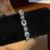 ¡Mar de Glamour en tu Muñeca! Pulsera de lazo ovalado de circón europeo y americano, sensación de lujo ligero y alta gama, joyería de nicho de moda
