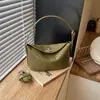 Bolso de mano liso súper popular transfronterizo para mujer, nuevo modelo 2026, diseño de nicho, bolso cruzado versátil de alta gama para el día a día