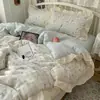 Juego de cuatro piezas floral 100% algodón Clase A, ropa de cama de algodón lavado, funda de edredón de encaje estilo coreano, funda de edredón y sábana de algodón puro