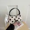 Bolso de mano de lunares estilo coreano para mujer, nuevo bolso de mujer más vendido 2026, bolso tipo almohada exquisito y versátil, bolso cruzado simple y moderno