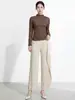 Top de mujer de alta gama Shenzhen Nanyou, elegante suéter irregular de color liso, camiseta base de manga larga ajustada estilo Issey Miyake