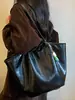 Bolso vintage de gran capacidad en color liso, nuevo modelo principios de otoño 2026, bolso de hombro simple personalizado estilo coreano casual para el trabajo y los desplazamientos