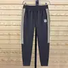 Moda Nova Primavera e Outono Terno Esportivo Casual Masculino Tendência Versátil Jaqueta com Gola Alta Calça Jogger Calça de Moletom Conjunto de Duas Peças