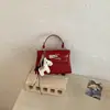 Bolso Kelly Sencillo Estilo Coreano para Mujer, Nuevo Modelo Primavera 2026, Bolso de Hombro para Mujer, Moda de Nicho, Bolso de Mano de Color Sólido, Bolso Cuadrado Pequeño