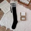 Calcetines de encaje Lolita para otoño e invierno, con volantes y lazo en el tobillo, calcetines largos de punto a rayas verticales para mujer, dulces y versátiles, estilo JK