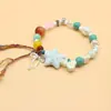 Venta al por mayor del fabricante Pulsera de Cerámica de Estilo Chino Nuevo de Nicho Pulsera Magnética de Perlas de Estrella de Mar Pulsera para Niños Joyería Retro de Estilo Nacional Venta al por mayor