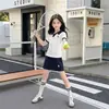 Conjunto de duas peças para meninas estilo coreano: top de camisa Polo de manga curta + calça saia, novo conjunto estiloso de verão 2026 para crianças