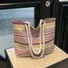 Bolso de Hombro Rayado de Paja de Gran Capacidad 2026 Verano Nuevo Moda Bloqueo de Color Moderno Simple Versátil