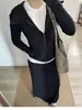 Impresionante atuendo estilo coreano: un conjunto completo de 2026 sudadera con capucha negra y falda nuevas para mujer, traje de principios de otoño