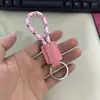 Llavero de cuerda tejida a mano de cuero para coche personalidad creativo colgante de llave patrón de texto imprimible venta al por mayor de fábrica
