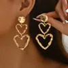 Pendientes Metálicos Plegados con Diseño de Corazón de Tres Capas Exagerado Personalizado Transfronterizos Europeos y Americanos Pendientes Versátiles de Gama Alta para Mujeres Venta al por Mayor