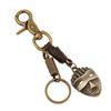 Llavero de piel de vaca vintage para hombre directo de fábrica, colgante decorativo de máscara de aleación, superventas en zona turística