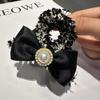 Horquilla de perla retro de Chanel, elegante lazo de celebridad cibernética, pinza para el pelo con forma de tiburón para otoño e invierno.