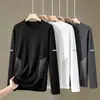 Camiseta de manga larga para hombre, adecuada para primavera y otoño, corte holgado, cuello redondo, capa interior fina, base elástica, versátil y moderna
