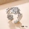 Joyería de Acero de Titanio de Moda Diseño Versátil Anillo de Flor Prensada en Aceite Resistente al Color Lujo Ligero Sensación de Alta Gama Anillo Abierto Ajustable