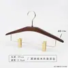 Percha para pantalones de madera maciza en color nogal negro, especialmente para tiendas de ropa, para uso doméstico y de hotel, sin marcas, antideslizante, percha con pinza de madera para pantalones al por mayor