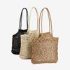 Bolso de paja de color sólido al por mayor de fábrica, nuevo bolso de paja hueca, bolso tejido, bolso de playa para vacaciones en la playa, bolso de hombro de moda