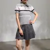 Traje estilo universitario gris con falda plisada, para mujer, otoño e invierno, de cintura alta, falda de línea A adelgazante con diseño anti-exposición