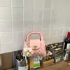 Bolso de mano de moda con cierre de hebilla de patrón de diamante para mujer, nuevo modelo 2026 bolso de hombro con cadena, bolso cruzado simple y elegante de nicho