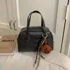 Bolsa de Bolos Portátil de Gran Capacidad para Mujer 2026 Nuevo Estilo Coreano Retro Bolso de Hombro Cruzado Bolso Almohada para Viajes de Negocios Moderno