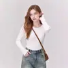 Top de malha canelada com babados, gola redonda e mangas compridas na cor damasco para mulheres, novo estilo de outono de 2026, de alta qualidade, modelagem justa, top interno que valoriza a silhueta