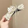 Pinza Plátano Plisada Vertical con Lazo Floral para Cola de Caballo de Verano 2026 Nuevos Pasadores para la Parte Posterior de la Cabeza Accesorios para el Cabello