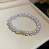 Pulsera de perlas con lazo de doble capa estilo vintage francés, diseño único y versátil, joyería de lujo ligero y de alta gama